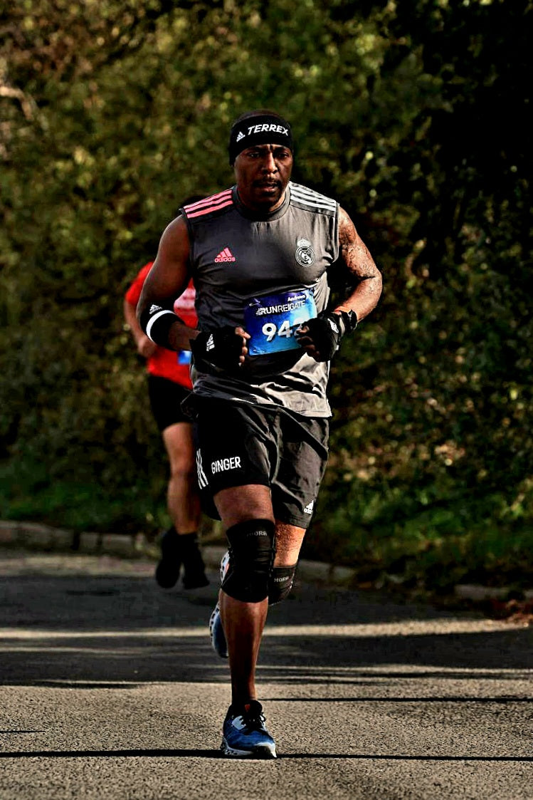 Emmanuel, founder of Cerebral Wolf, running in a half marathon in 2022